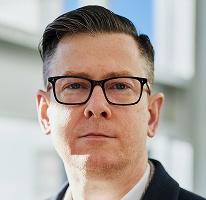 Alexander Hughes, CEO kryptomenovej obchodnej spoločnosti, portrét